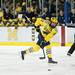 Michigan junior defenseman Mac Bennett passes the puck in the first period of the game against Notre Dame on Friday. Daniel Brenner I AnnArbor.com